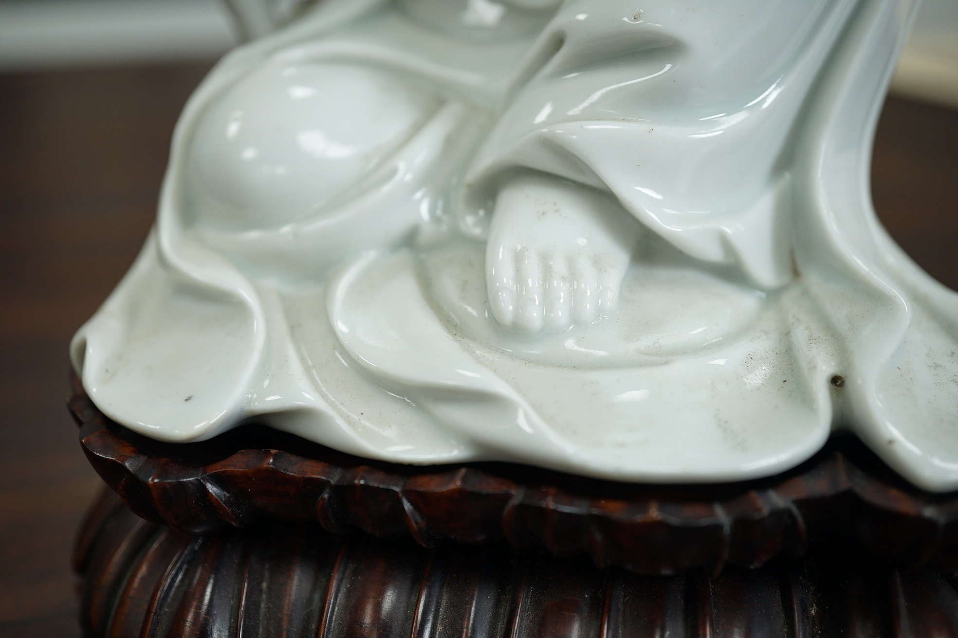 A Chinese blanc-de-chine seated figure of Guanyin, late 19th/early 20th century